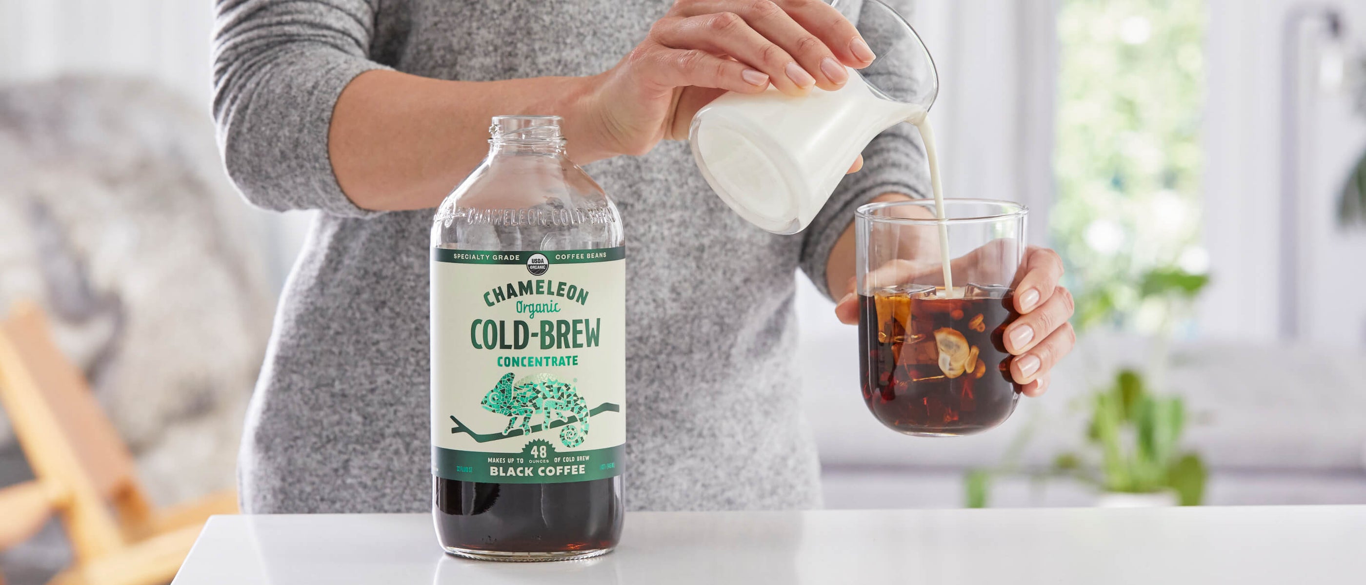 Woman pouring ccb into bottle.